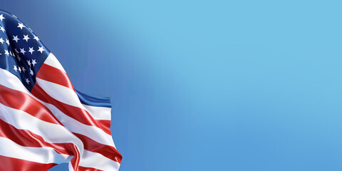 Obraz premium An American flag with red and white stripes waves proudly against a clear blue sky