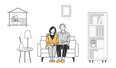 ソファに座るシニア男性とシニア女性の家族