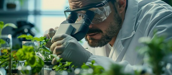 Scientist Examining Plant Samples Under Microscope in Laboratory for Botanical Research and Scientific Study