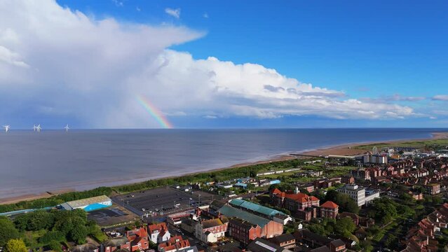 Looming storm over the seaside town of Skegness. English Holiday reasort showing caravan sites and hotels with stormy sky&rsquo;s over the ocean. British Coastal scene with bad summer weather