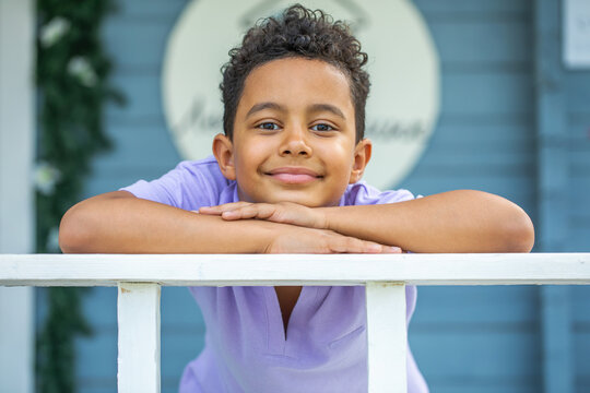Close up portrait of an eight year old mixed race boy, summer outdoor