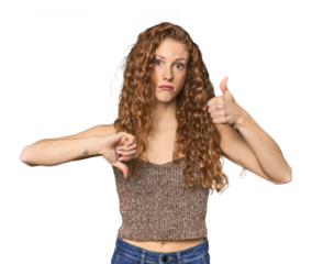 Simple redhead studio portrait showing thumbs up and thumbs down, difficult choose concept