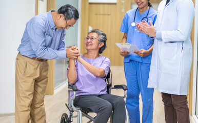 Fototapeta premium Man doctor with stethoscope service help support discussing and consulting care talk to sick senior asian woman patient in hospital,caregiver,elderly,recovery,illness insurance.healthcare and medicine