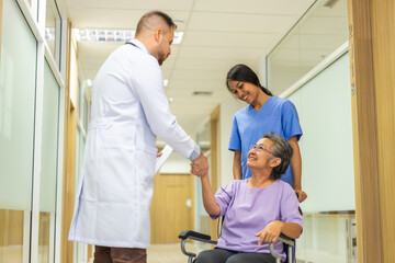 Obraz premium Man doctor with stethoscope service help support discussing and consulting care talk to sick senior asian woman patient in hospital,caregiver,elderly,recovery,illness insurance.healthcare and medicine