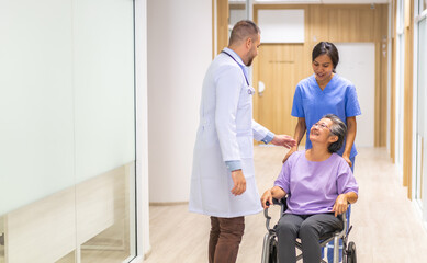 Obraz premium Man doctor with stethoscope service help support discussing and consulting care talk to sick senior asian woman patient in hospital,caregiver,elderly,recovery,illness insurance.healthcare and medicine