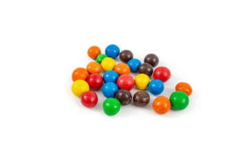 Multicolored chocolate balls pile, isolated on white background