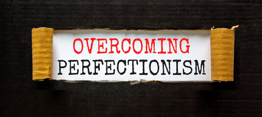 Overcoming perfectionism symbol. Concept words Overcoming perfectionism on beautiful white paper....