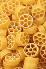 Closeup of uncooked rotelle pasta, showcasing the texture and shape