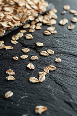 Scattered oats on a dark slate background
