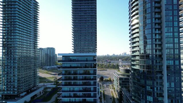 Aerial drone close up footage of highrise buildings in Humber Bay Etobicoke Toronto Canada on a sunny day with blue sky