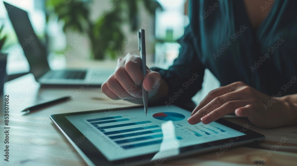 Aufkleber a financial analyst pointing to a bar graph on a digital tablet, discussing quarterly revenue and pr