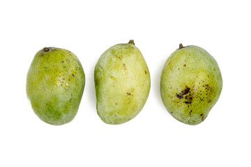 fresh green mango with visible blemish or imperfection, isolated on white background