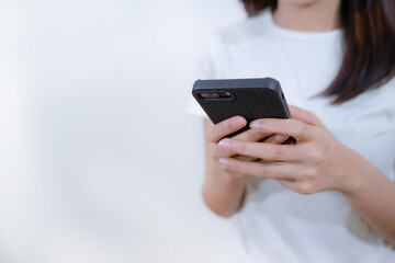 Hand of woman using smartphone. isolated white background