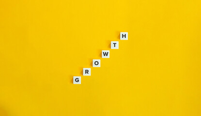 Growth Word and Banner. The Development Concept of Economics. Letter Tiles on Yellow Background....