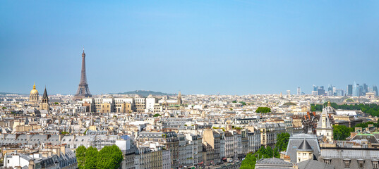 Paris street with view on the famous paris eiffel tower on a sunny day with some sunshine