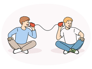 Smiling boys talk on tin can phone. Happy children have fun speak on handmade cups telephone. Childhood. Vector illustration.