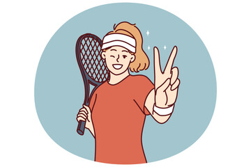 Woman tennis player demonstrates victory gesture before tournament or championship against professional opponent. Girl with tennis racket stands on court playing sports leads healthy lifestyle