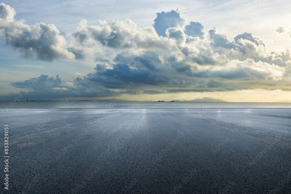 Wall mural asphalt road square and sea with sky clouds natural background