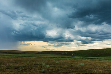 Black sky clouds natural landscape on grassland before the rainstorm