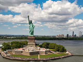 The Statue of Liberty over the Panorama of New York cityscape. New York city skyline with statue of liberty. The statue of Liberty and Manhattan. © Volodymyr