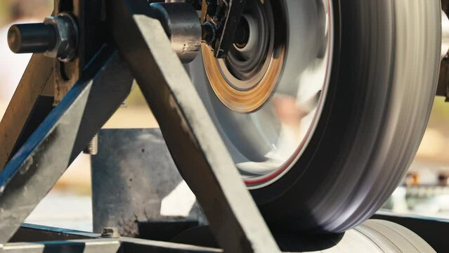Slow motion footage shows intricate engineering of a fast spinning wheel, highlighting precision and technology