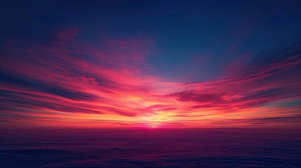 Mesmerizing sunrise over an expansive horizon with fiery red and pink clouds