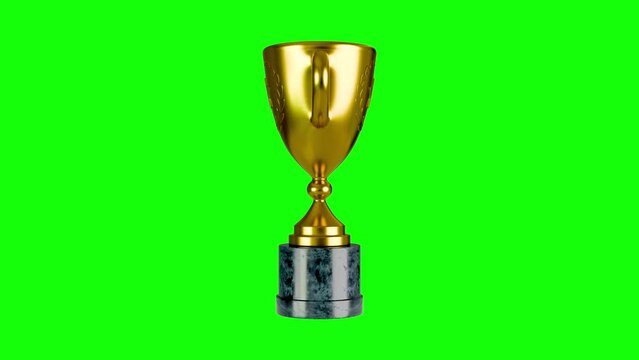 Golden trophy turning on green background 