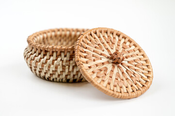 Wicker basket with lid on a white background, isolate, close-up