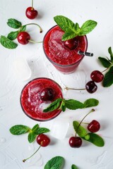 Fresh fruit and mint leaves arranged in glasses, perfect for a healthy snack or decoration