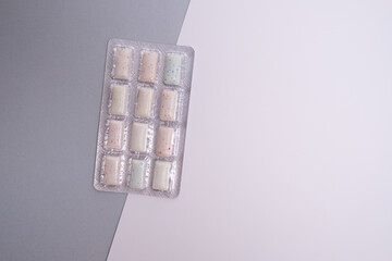 A package of chewing gum on a colored background. Place for text. Healthy teeth and hygiene concept