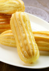 traditional choux pastry eclair dessert on a plate