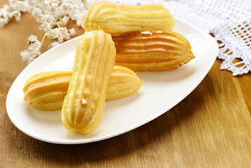 traditional choux pastry eclair dessert on a plate