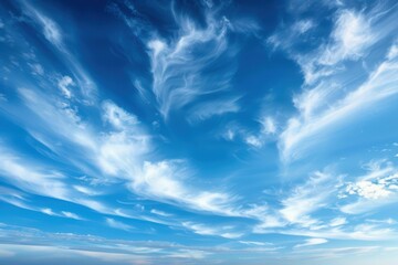 Beautiful blue sky with scattered white clouds on a sunny day, capturing the serene and calm atmosphere perfect for backgrounds or nature themes.