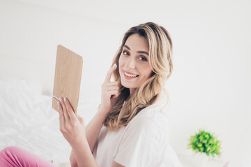 Photo of positive girl hold mirror applying lotion in day light room indoors