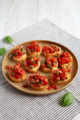 Homemade Italian Tomato Bruschetta on a Plate, side view.