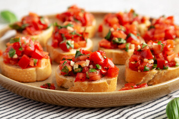 Homemade Italian Tomato Bruschetta on a Plate, side view. Close-up.