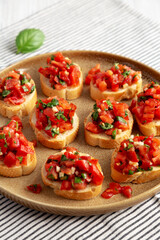 Homemade Italian Tomato Bruschetta on a Plate, side view.