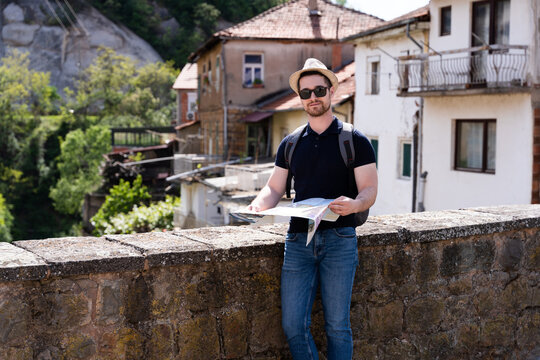 A young man explores new destinations by traveling through North Macedonia.