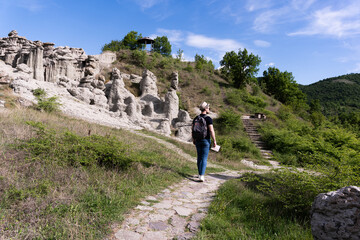 A young man explores new destinations by traveling through North Macedonia.