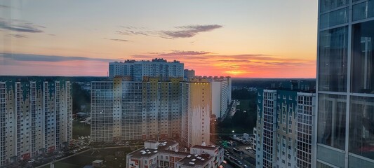 Urban Cityscape featuring High Rise Buildings at Sunset with Beautiful Reflections