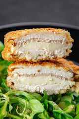 cutlet cordon bleu chicken meat, ham, cheese natural fresh appetizer meal food snack on the table copy space food background rustic top view