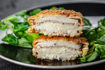 cutlet cordon bleu chicken meat, ham, cheese natural fresh appetizer meal food snack on the table copy space food background rustic top view