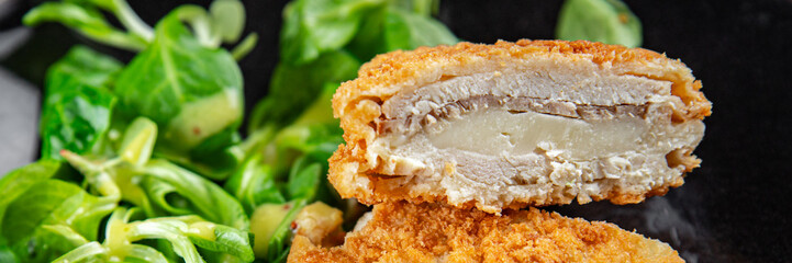 cutlet cordon bleu chicken meat, ham, cheese natural fresh appetizer meal food snack on the table copy space food background rustic top view
