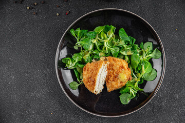 cutlet cordon bleu chicken meat, ham, cheese natural fresh appetizer meal food snack on the table copy space food background rustic top view