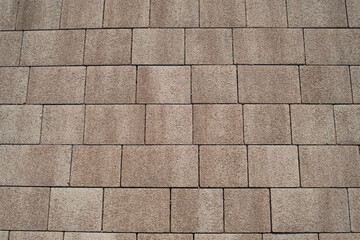 A road paved with sidewalk blocks
