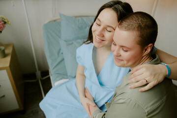 Fototapeta premium Women hugging each other and sharing this unforgettable experience