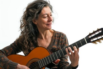Portrait of a cheerful woman in her 40s playing the guitar in front of white background
