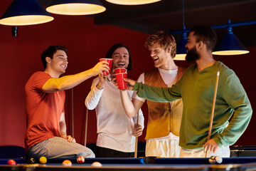 Friends raise their red cups in a toast during a relaxed billiards game.