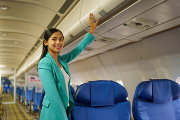 Asian attractive business woman passenger sitting on business class luxury plane while relax while travel concept