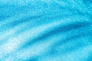 Abstract blurred blue glitter texture background, shiny blue glitter background